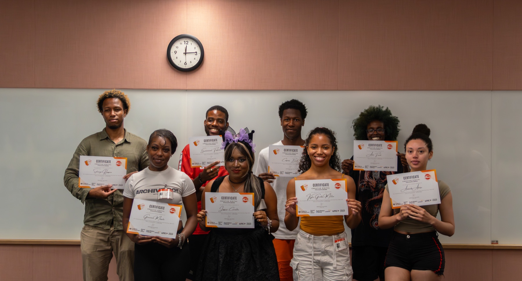Young people celebrating skills achievement with certificates
